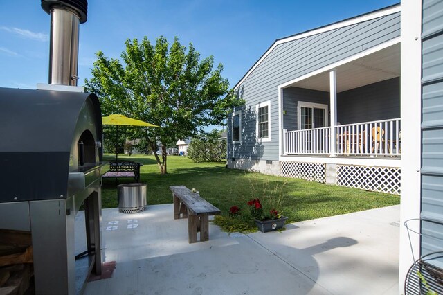 614 Strawberry St, Cape Charles, VA 23310 - porch with a lawn and grilling area