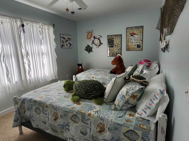 carpeted bedroom with ceiling fan