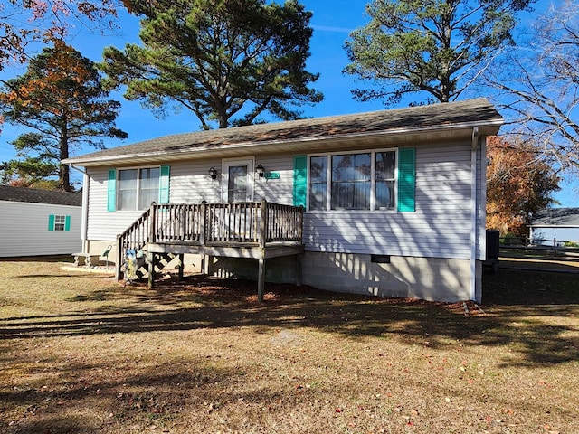 rear view of house with a yard