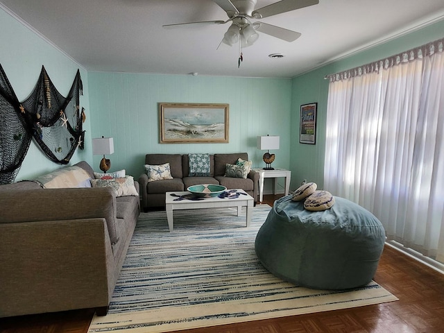 living room featuring dark parquet floors and ceiling fan