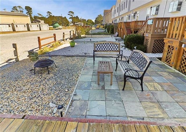 view of patio / terrace with an outdoor fire pit