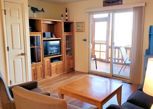 living room with light hardwood / wood-style flooring