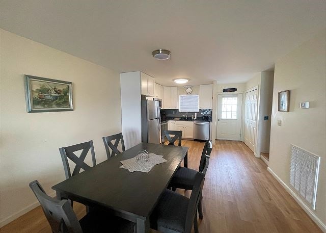 dining area featuring light wood-type flooring