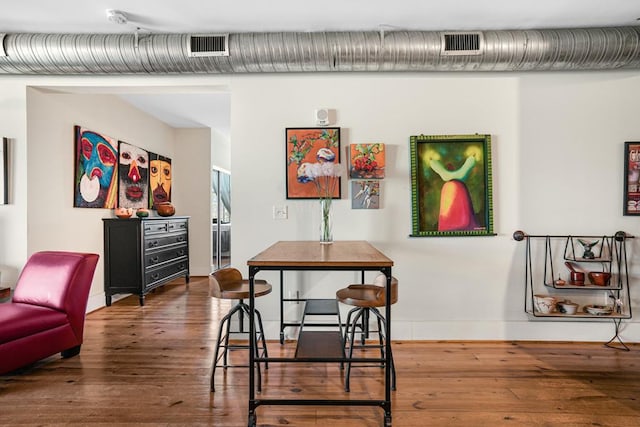 dining room with hardwood / wood-style flooring