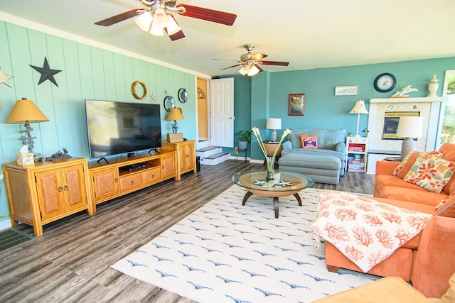 living room featuring ceiling fan and wood finished floors
