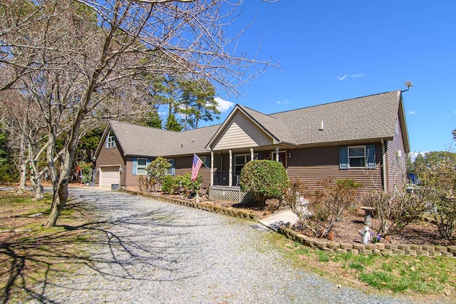 ranch-style home with driveway and a garage