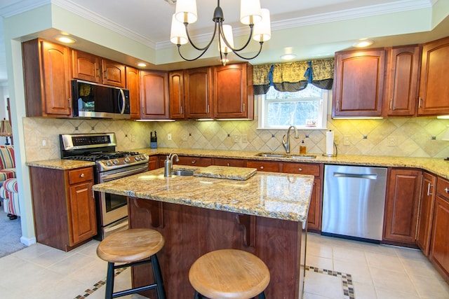kitchen featuring a chandelier, ornamental molding, stainless steel appliances, a sink, and light stone counters