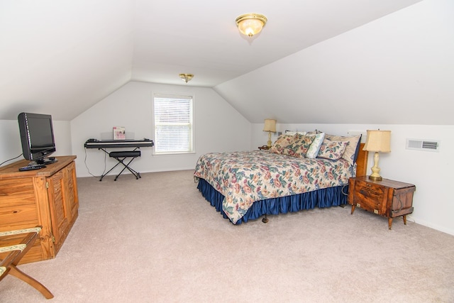 bedroom featuring visible vents, vaulted ceiling, and light colored carpet