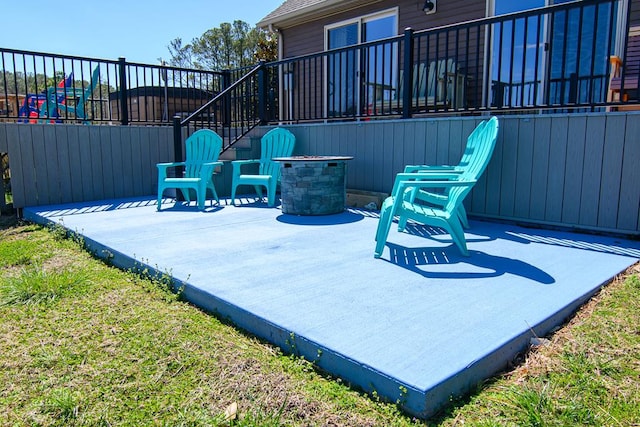 view of patio featuring fence
