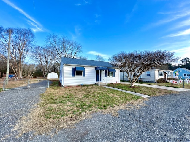 ranch-style house with a front lawn