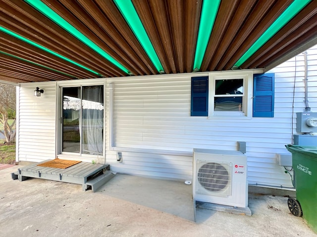 view of home's exterior featuring ac unit and a patio