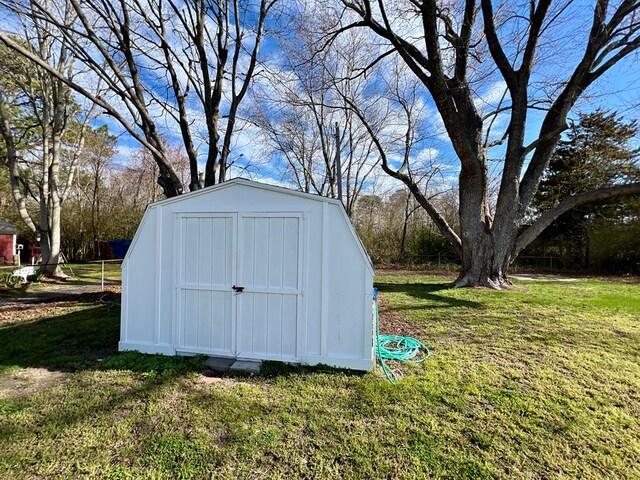 back of property featuring a lawn