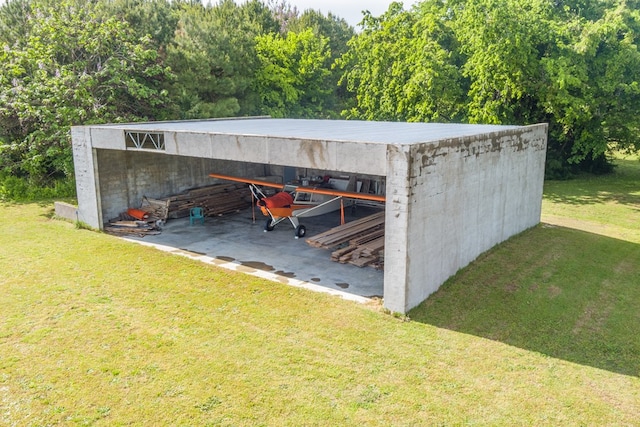 view of outbuilding with a lawn