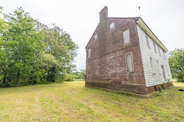 view of property exterior featuring a lawn