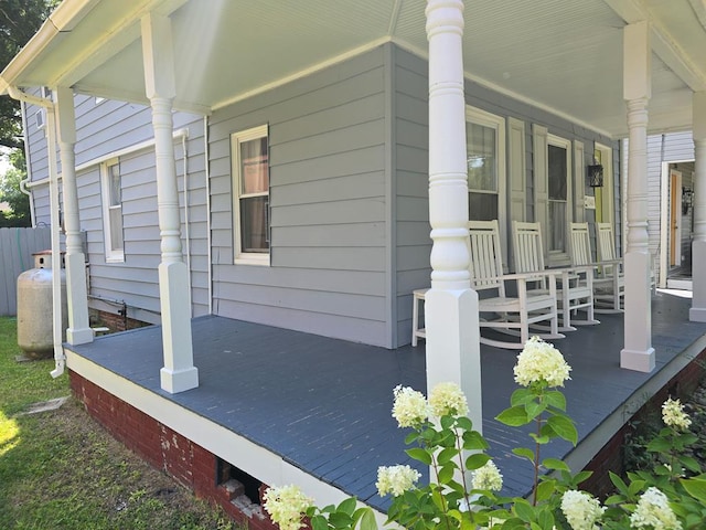 view of side of home featuring a porch