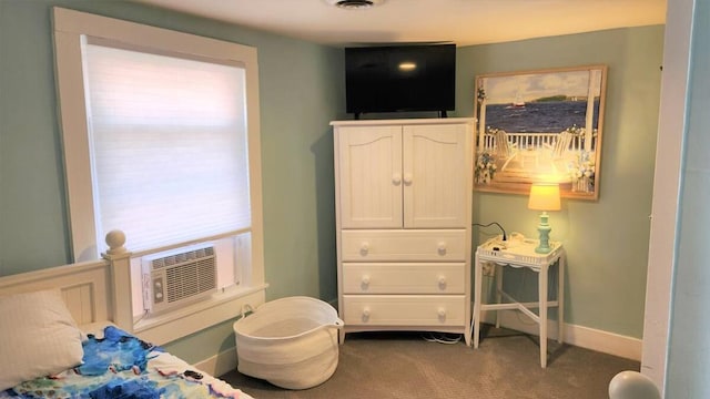 bedroom featuring cooling unit and carpet