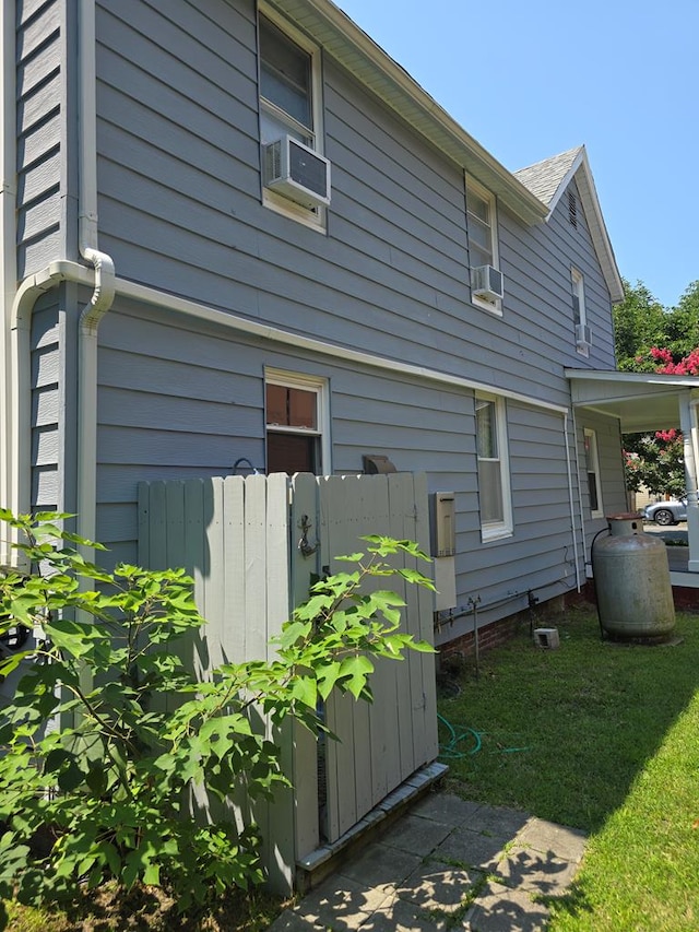 view of side of home featuring cooling unit