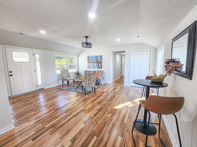 5065 Cobbs Station Rd, Cape Charles, VA 23310 - foyer with a textured ceiling, lofted ceiling, light wood finished floors, and recessed lighting