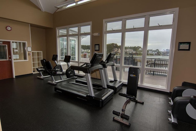 gym featuring vaulted ceiling