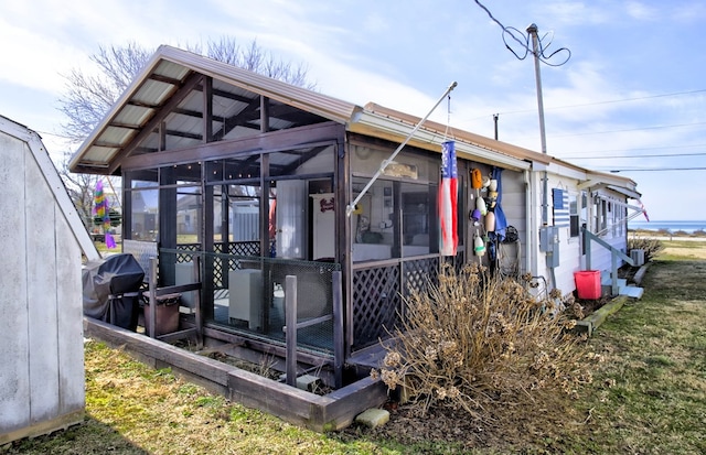 exterior space featuring a sunroom