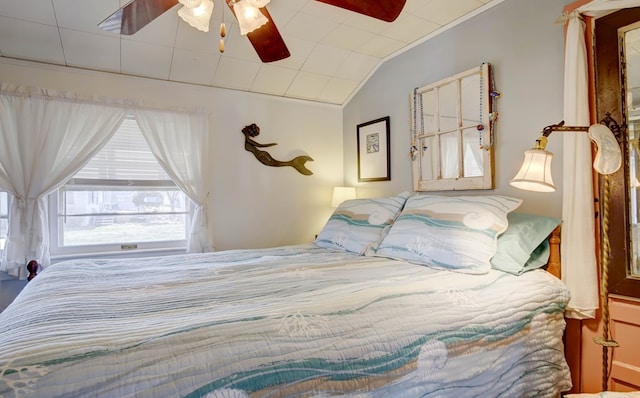 bedroom featuring lofted ceiling and ceiling fan