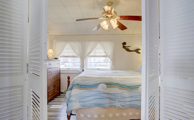 bedroom featuring ceiling fan and wood finished floors