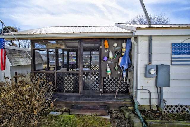 exterior space with metal roof