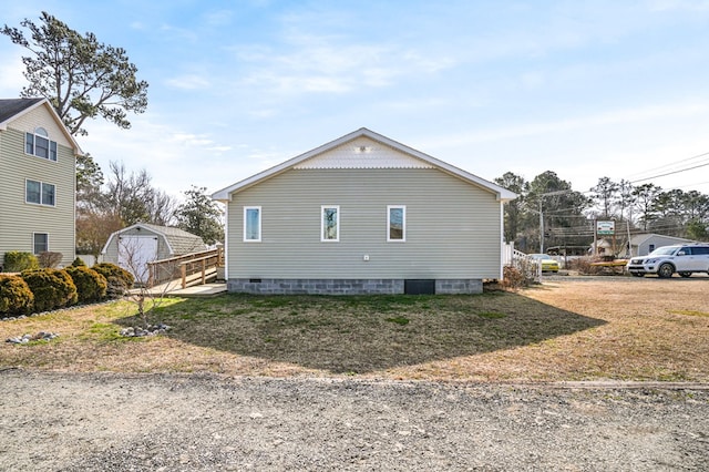 view of property exterior with a lawn