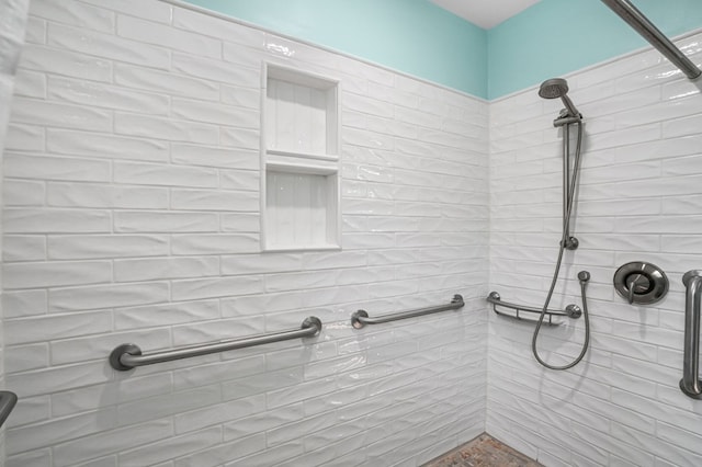 full bathroom with a tile shower