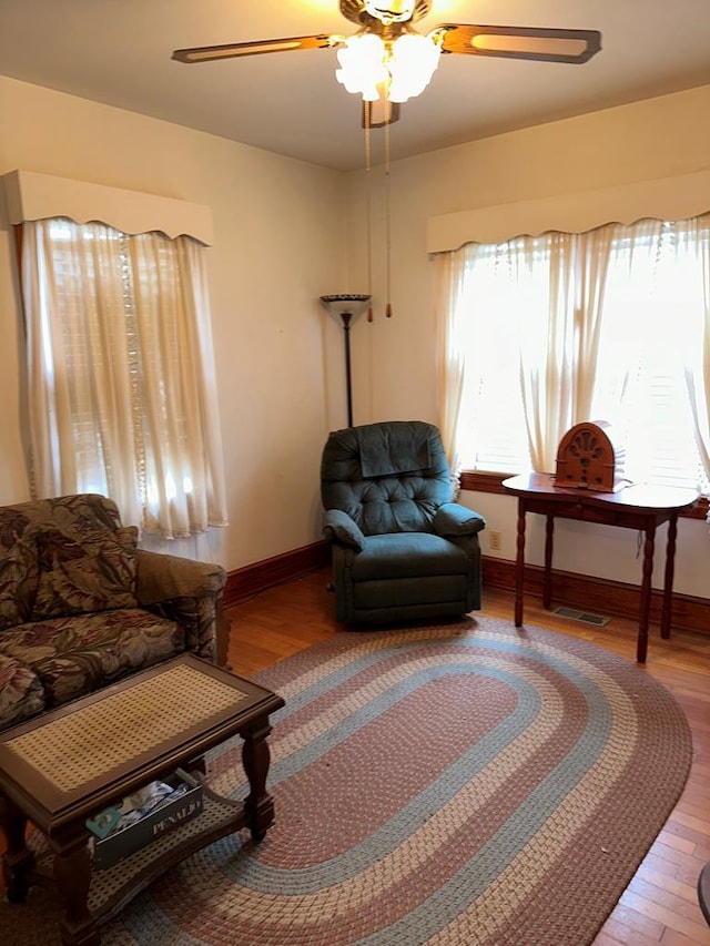 3533 Ridge Rd, Chincoteague, VA 23336 - living room featuring ceiling fan, wood finished floors, and baseboards