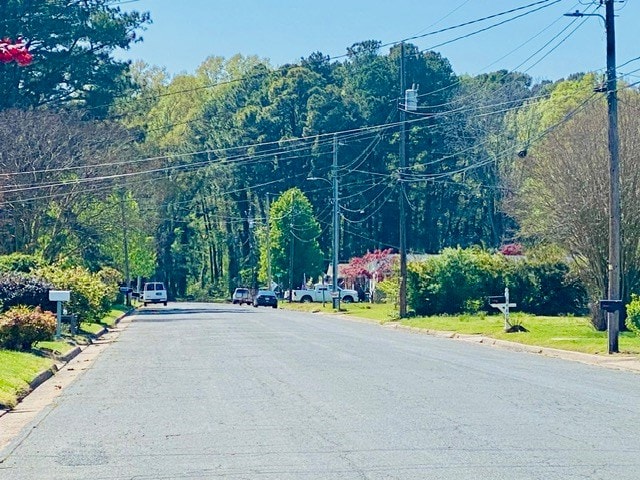 view of street featuring curbs and street lights