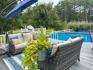 outdoor pool featuring a wooden deck