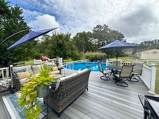 pool with a wooden deck