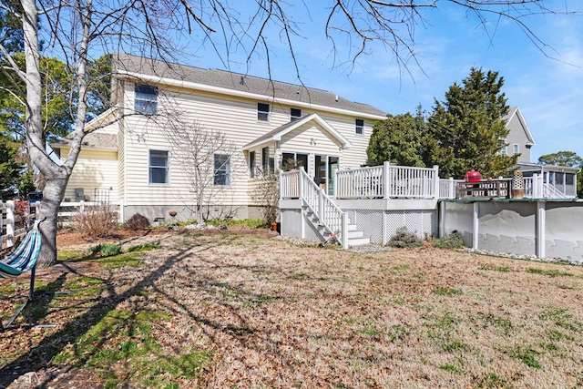 view of front of house with an outdoor pool, a wooden deck, and stairway