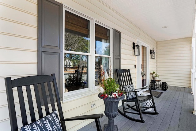 wooden terrace featuring covered porch
