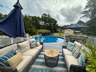 outdoor pool with an outdoor hangout area