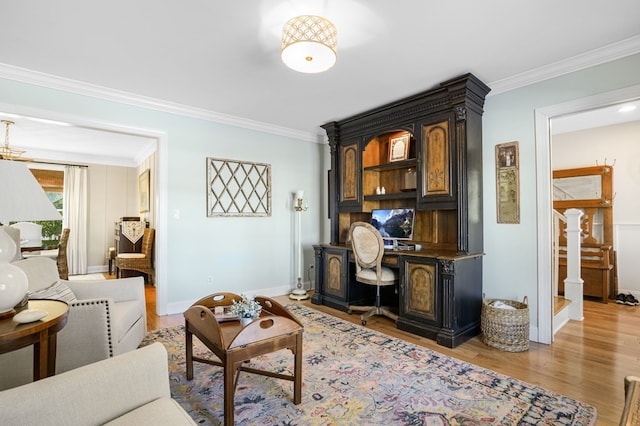 home office featuring light wood finished floors, baseboards, and ornamental molding
