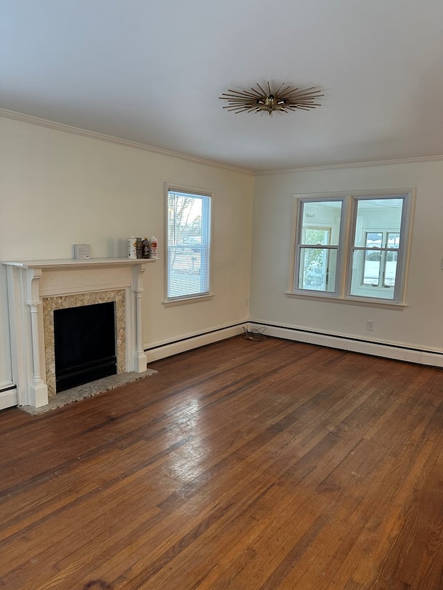 unfurnished living room with crown molding, hardwood / wood-style flooring, and a high end fireplace