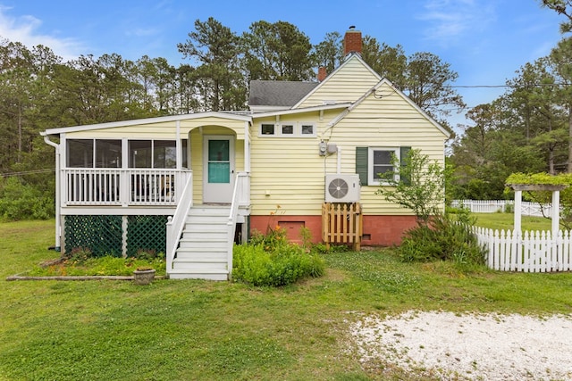 14457 Broadway Rd, Onancock, VA 23417 - view of front facade featuring a chimney, a sunroom, and crawl space
