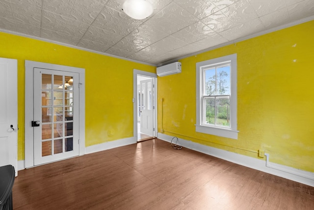 14457 Broadway Rd, Onancock, VA 23417 - spare room with a wall mounted AC, wood finished floors, crown molding, and an ornate ceiling