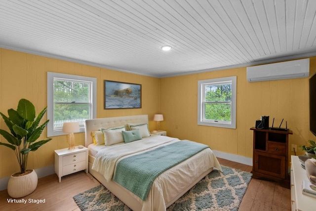 14457 Broadway Rd, Onancock, VA 23417 - bedroom with a wall mounted AC, hardwood / wood-style flooring, crown molding, and wood ceiling