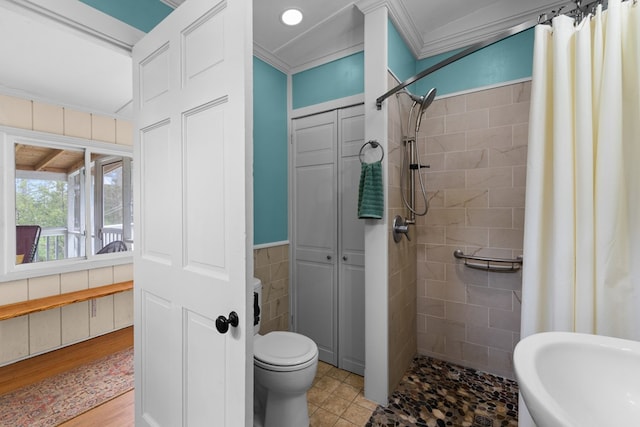 14457 Broadway Rd, Onancock, VA 23417 - bathroom with tiled shower, a closet, and crown molding