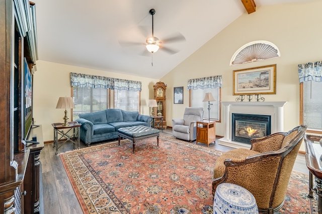 living room featuring beamed ceiling, dark hardwood / wood-style floors, ceiling fan, and high vaulted ceiling