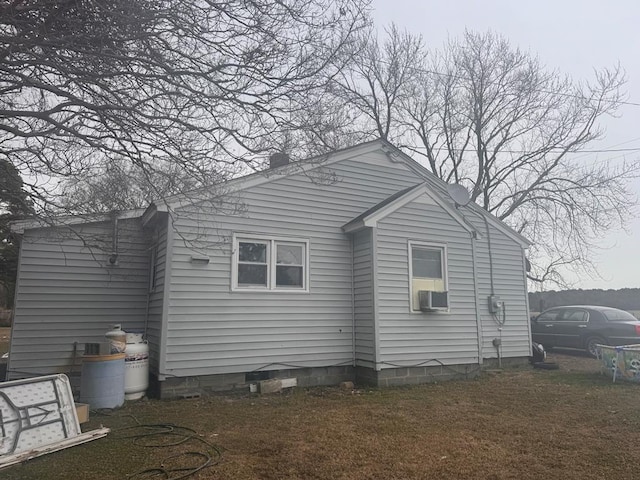 rear view of house with cooling unit