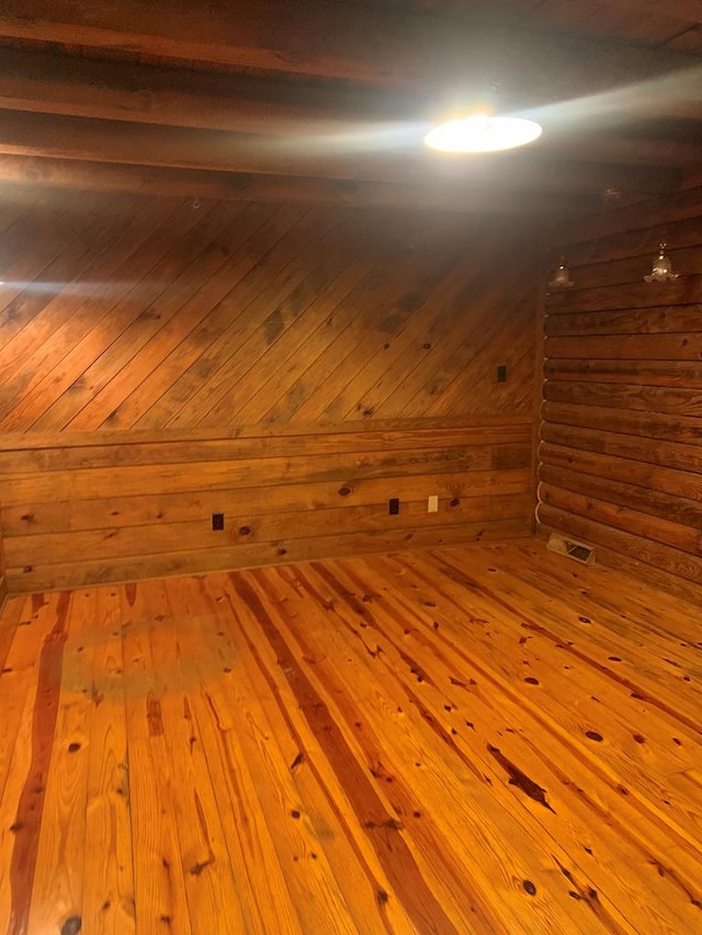 bonus room with light hardwood / wood-style flooring