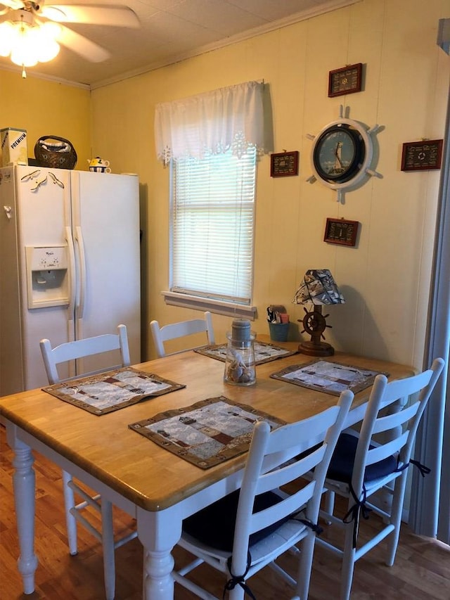 2561 Captains Corridor, Greenbackville, VA 23356 - dining room featuring wood finished floors, ornamental molding, and a ceiling fan