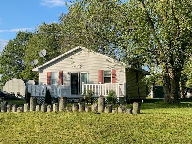 2561 Captains Corridor, Greenbackville, VA 23356 - bungalow-style house with a front lawn