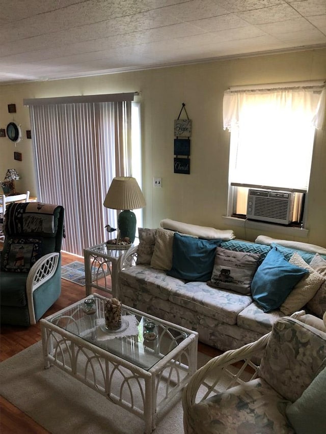 2561 Captains Corridor, Greenbackville, VA 23356 - living room featuring wood finished floors, healthy amount of natural light, cooling unit, and crown molding