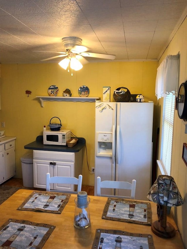 2561 Captains Corridor, Greenbackville, VA 23356 - kitchen with white appliances and a ceiling fan