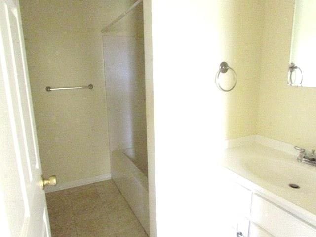 bathroom with tile patterned flooring and vanity